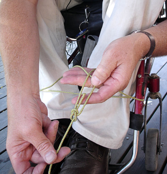 User ties a bowline knot